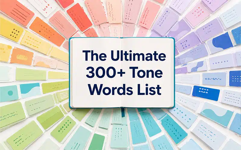 Open book displaying the ultimate 300+ tone words list, surrounded by colorful cards representing different tones and writing styles.